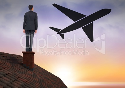 Businessman on roof with plane icon