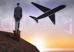 Businessman on roof with plane icon