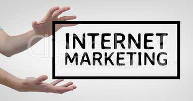 Hands interacting with internet marketing business text against white background