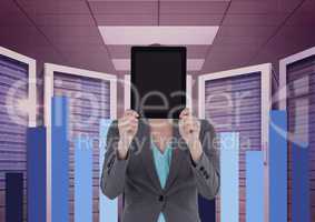 Business woman holding a tablet and graphics in server room
