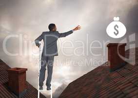 Businessman on property ladder reaching for money icon over roofs