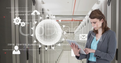 Business woman holding a tablet and graphics in server room