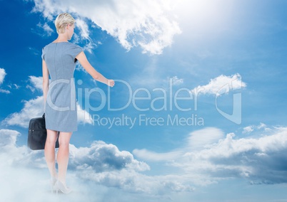 Businesswoman with briefcase in sky