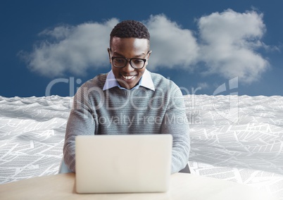man on laptop in sea of documents under sky clouds man on laptop in sea of documents under sky clouds