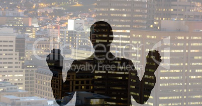 Business man silhouette against city
