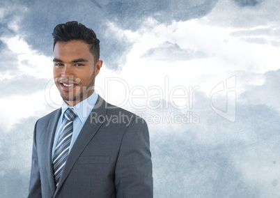 Businessman  in front of clouds