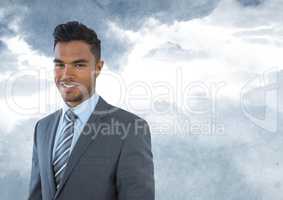 Businessman  in front of clouds