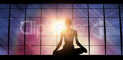 Composite image of silhouette image of female practicing meditation