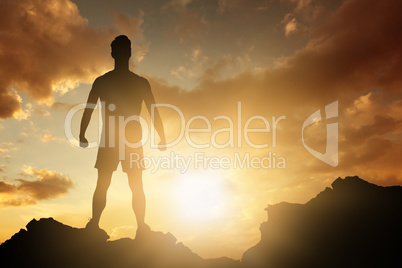 Composite image of male athlete standing on white background