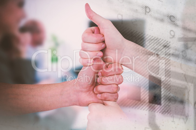 Composite image of cropped image of friends stacking fists