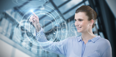 Composite image of happy businesswoman using imaginative digital screen
