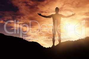 Composite image of athlete man standing with arms outstretched