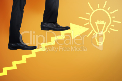 Composite image of low section of businessman climbing steps