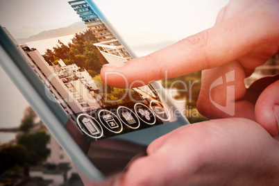 Composite image of hands using tablet on white background