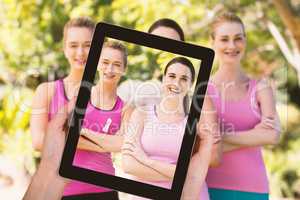 Composite image of close-up of hands holding digital tablet