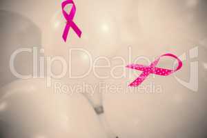 Close-up of pink Breast Cancer Awareness ribbons on balloons