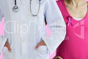 Composite image of female doctor standing with hands in pocket