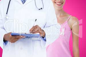 Composite image of midsection of male doctor writing on clipboard