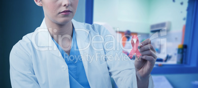 Composite image of female scientist writing on board