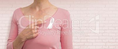 Composite image of woman in pink outfits showing ribbon for breast cancer awareness