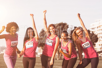 Cheering women supporting breast cancer marathon