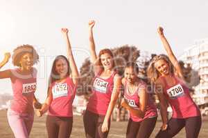 Cheering women supporting breast cancer marathon