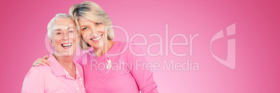 Composite image of portrait of happy daughter with mother supporting breast cancer awareness