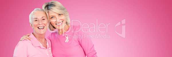 Composite image of portrait of happy daughter with mother supporting breast cancer awareness