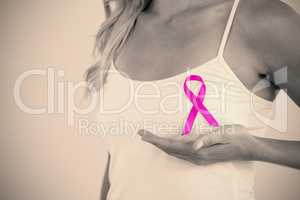 Mid section of woman supporting breast cancer awareness