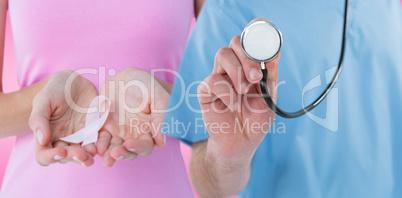 Composite image of midsection of surgeon holding stethoscope