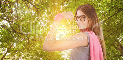 Composite image of portrait of confident woman in superhero costume