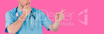 Composite image of surgeon pretending to be using futuristic digital screen