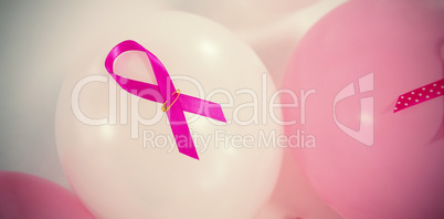 High angle view of pink Breast Cancer ribbons on balloons