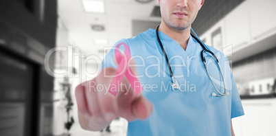 Composite image of surgeon pretending to be using futuristic digital screen