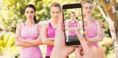 Composite image of hands touching smart phone