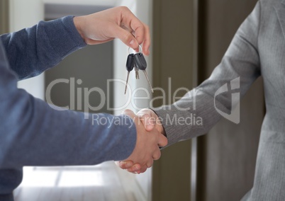 Hands Holding key  in home hall