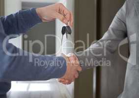 Hands Holding key  in home hall
