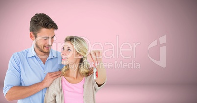 Couple Holding key in front of vignette