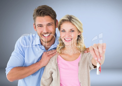 Couple Holding key in front of vignette