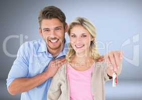 Couple Holding key in front of vignette