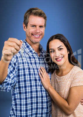 Couple Holding key in front of vignette