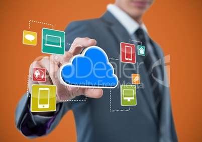 businessman with hand spread of  taking cloud with application icons. Orange background