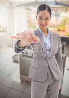Woman Holding key in kitchen