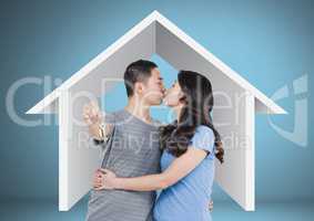 Couple Holding key with house icon in front of vignette