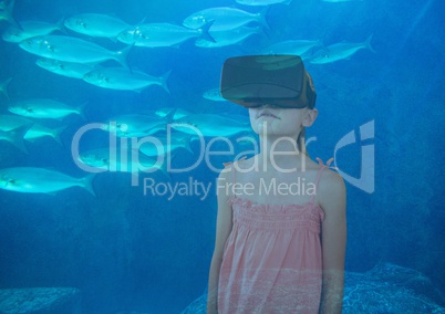 girl with VR glasses on the sea with the fishes