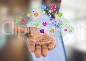 businessman with hand spread of  with application icons over. Blurred office
