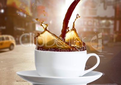 Coffee being poured into white cup against blurry street with flares