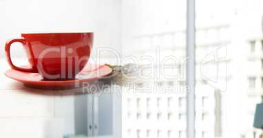 Red coffee cup with beans and blurry window transition