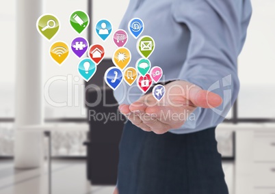 woman with hand spread of  with application icons coming up form it and earth  Blurred office backgr