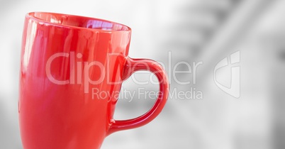 Red cup against blurry grey stairs